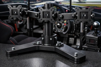 Independent monitor stands that solve cockpit compatibility without desk clamps or drilling.